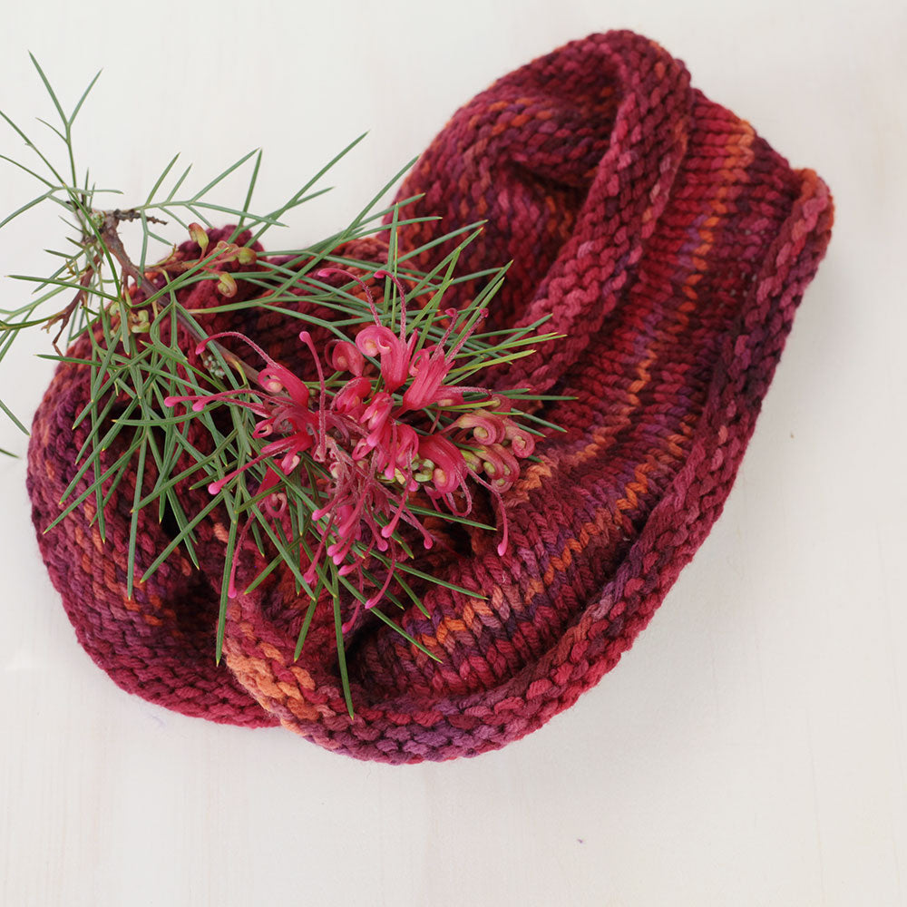 Grevillea flower with a hand knitted cowl in 8ply.